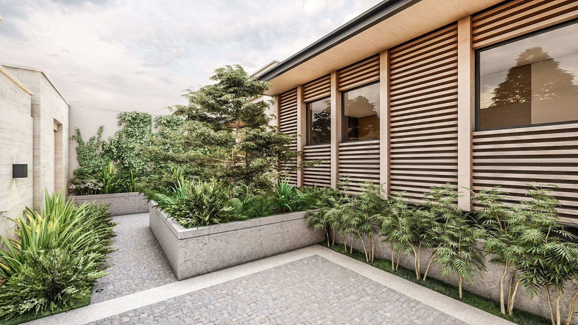 Modern courtyard with lush green plants, gravel pathways, and contemporary building architecture.