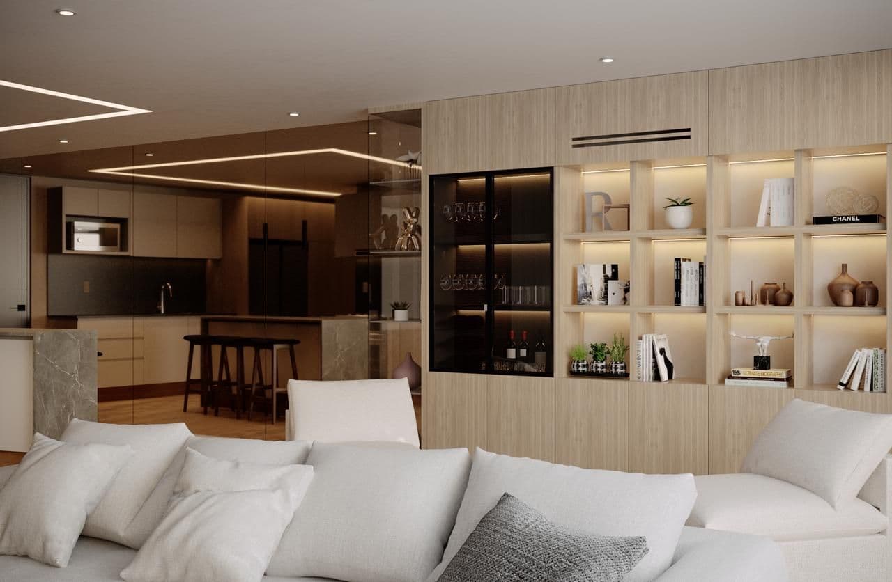 Modern living room with plush white sofa and built-in light wood shelving displaying books and decor.