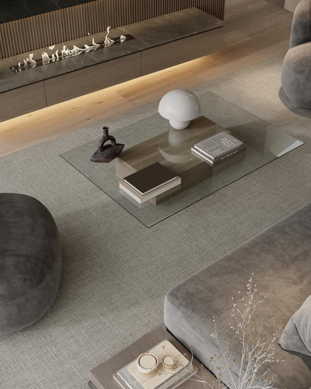 Modern living room with a glass coffee table and plush seating.
